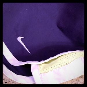 Nike shorts. Purple norts with lime yellow